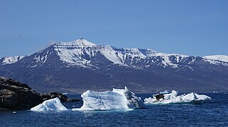 Qilertiinguit Kangilequtaa (2,070 m (6,791 ft))[2] seen from Uummannaq across the main arm of Uummannaq Fjord