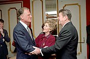 President Ronald Reagan and Nancy Reagan greet Billy Graham at the National Prayer Breakfast held at the Washington Hilton, 1981.