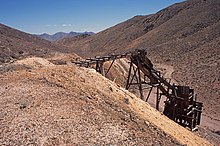 A trestle and ore bin at the Eagleville Mine, Mineral County, Nevada. Mount Annie and Mount Anna are in the distance.