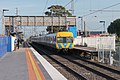 Southbound view from the former ground level Platform 1, with a Comeng train on Platform 2, March 2021