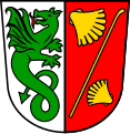 Gemeinde Zenting Gespalten von Silber und Rot; vorne ein links gewendeter, widersehender, feuerspeiender, rot bewehrter grüner Drache mit Stachelschwanz, hinten ein schräglinker goldener Pilgerstab, beseitet oben und unten von je einer zugewendeten goldenen Muschel.