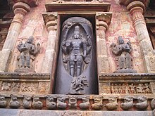 Sculpture of a lingam with Shiva emanating out of it with Vishnu on the right and Brahma on the left