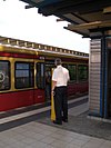 A platform dispatcher assisting one-man operation on the Berlin S-Bahn in 2008