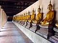 Row of Sukhothai Buddha images