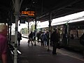 Picture of people getting on a train on Platform 1