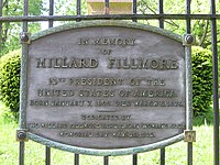 A memorial to Fillmore on the gate surrounding his plot in Buffalo