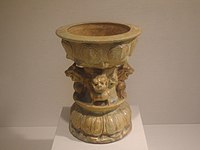 A footed earthenware lamp with lions, from either the Northern Dynasties period or Sui dynasty, 6th century