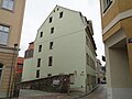 Wohnhaus in geschlossener Bebauung und in Ecklage, mit Seitenflügel zum Hof