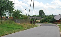 Houses by the road in Istok