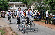 Girls going to school by bicycle in Saigon, Vietnam