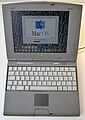 Startbildschirm des klassischen Mac OS auf einem PowerBook Duo 2300c