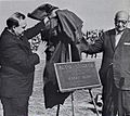 Unveiling of Plaque during halftime of dedication game. Millard Roberts on left, Harry Blum on right