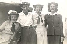 Photo of enlisted SPARS wearing uniforms of different styles during World War II