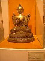 An Indian Buddha, seated with legs crossed