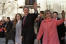 The Clinton family walking and greeting the crowds