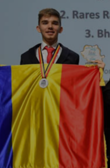 Rareș Razvan Gheorghe (Romania) at 2024 IJSO, wearing a gold medal and holding his award for 2nd-highest score in Biology.