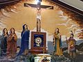 The Stone enshrined above the chapel altar, with a new mural behind it