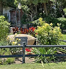 A small decorative flower garden is seen near the main entrance to the Paso Robles Event Center complex during the summer of 2023.