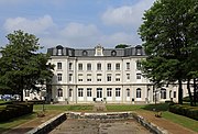 Het Château Mercier van de parkzijde gezien