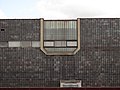 Ceramic cladding of the facade with a set of windows