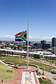 The South African Flag flying on half mast outside the Donkin Reserve in Port Elizabeth during the national mourning period for Nelson Mandela. It is said to be the tallest flagpole in Africa and the largest South African flag in the world. South Africa. December 2013.
