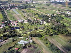 Single-family housing in Jeziorki and the Zgorzała lake, in 2011.