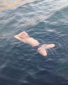 Photograph of Victor Skumin floating in a yoga pose