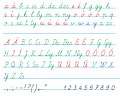 Handwritten cursive alphabet with all lowercase letters followed by capitals and punctuation, with consonants in green and vowels in red