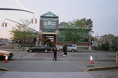 Commuters transfer from train to bus.