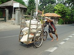 A loaded cargo trike being pushed in Jakarta, Indonesia