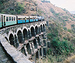 A typical passenger train on one of the Kalka-Shimla Railway's big bridges