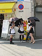 Maid cafe 1.JPG (2008-08-09 15:43:58) Teenage girls dressed as maids handing out promotional flyers for a Maid Cafe in Den-Den Town, Osaka, Japan