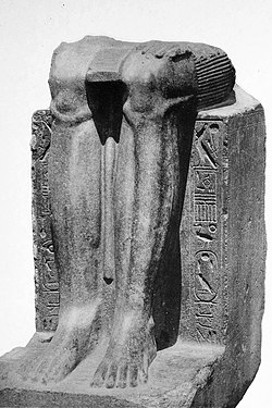 Remains of a statue of the Twelfth Dynasty reappropriated by Hyksos ruler Khyan, with his cartouche inscribed on the sides over an erasure.[1]