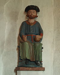 Statue of Saint Olaf wearing a tricorne uniform hat.