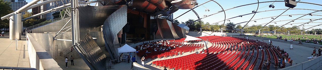 Panoramic shot of the Jay Pritzker Pavilion, showing the stage area to the garden seating area.