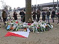 Local residents have brought flowers to commemorate the victims of the tram attack. City flag of Utrecht