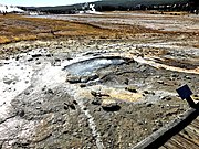 Ear Spring in September 2018 showing areas where bacterial mats had been killed (compared to image of 2013) and rocks spouted out of the spring after a rare eruption on September 15, 2018