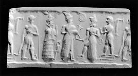 Tapanlarla çevrili Şamaş'ı tasvir eden eski Babil silindir mühür baskısı (MÖ 1850-1598 y. )
