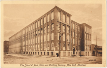 Sepia-toned photograph of the brick building on a postcard, with the caption "The John W. Peck Shirt and Clothing Factory, Mile End, Montreal"