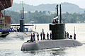 The Korean submarine Choi Museon makes its way past the United States Navy's USS Helena (Los Angeles class) and into the Sembawang port facilities in Singapore during Exercise PACIFIC REACH 2000.