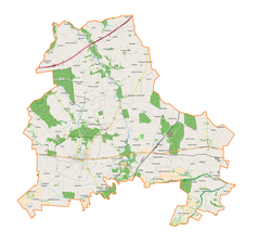 Mapa konturowa powiatu brzezińskiego, blisko centrum po prawej na dole znajduje się punkt z opisem „Dąbrowa”