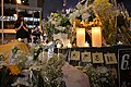 At the memorial site’s "flowerbed," some people placed heartfelt cards, electronic candles, and paper cranes.