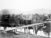 The Prince Alfred bridge crosses the Murrumbidgee River at Gundagai, photographed c. 1885.