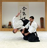 Shihōnage technique performed in "half-seated" position (hanmi hantachi waza).