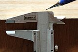 Marking a set or measured distance from an edge by marking with a pencil. The top of the moving part is held against the side of the step. Not all calipers have this option.
