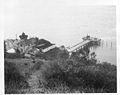 View from atop mountain down at the light station and pier – U.S. Coast Guard Archive