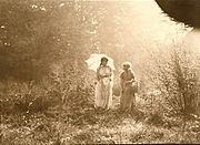 Strolling with a parasol, 1910s