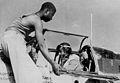 Staff Sgt. Alfred D. Norris...crew chief of a fighter group of the 15th U.S. Air Force, closes the canopy of a P-51 Mustang for his pilot, Capt. William T. Mattison...operations officer of the squadron based in Italy."