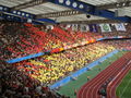 Tysklands herrelandslags supporteres tifo. Et flammehav av rød, gul og svart mosaikk.