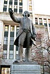 A statue of George Vancouver outside of Vancouver City Hall in Vancouver, British Columbia.